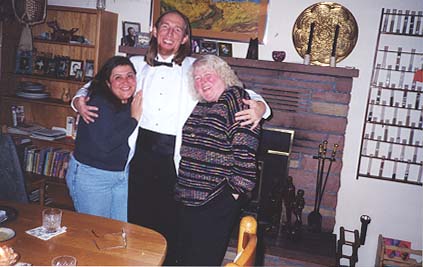Jim in his tux with arms around Barb and Deborah.