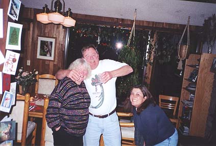 Bob encouraging Deborah to have some more mead while Barb urges him on.