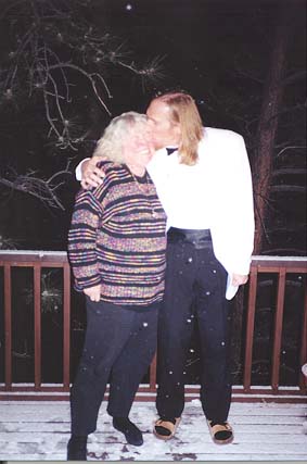 Jim kisses a grimacing Deborah on the deck as the snowflakes begin to fly.